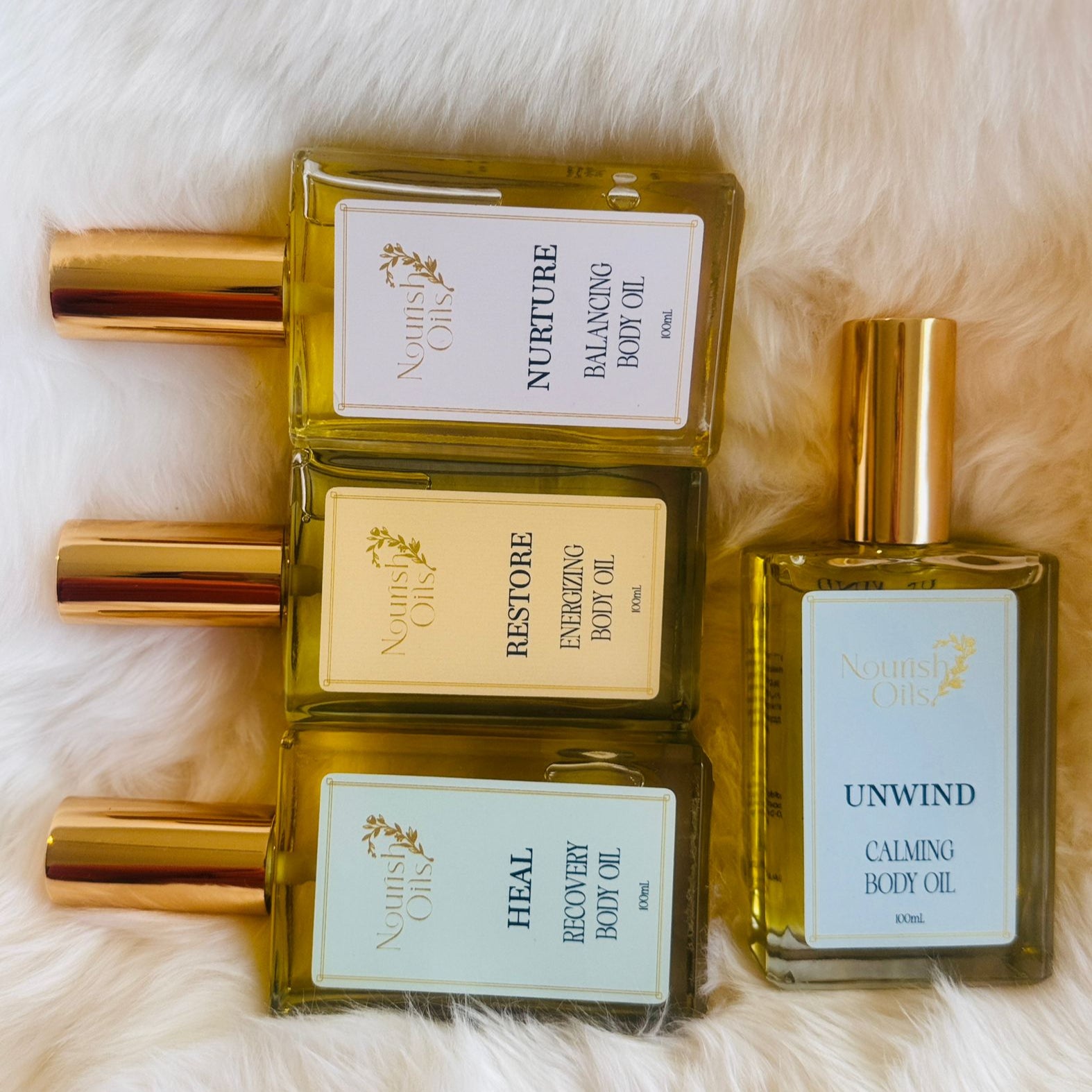 Nurture Oil pictured alongside Unwind and Nurture Oils by Nourish Oils, a clean and natural wellness body care massage and body oils
