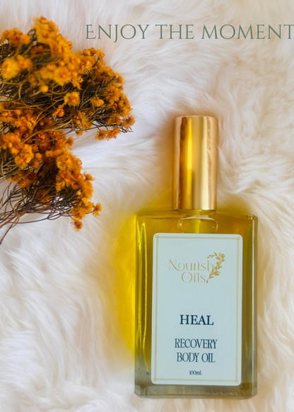 Golden drops of Heal Body and Massage Oil showing lightweight, fast-absorbing texture ideal for deep tissue relief.
