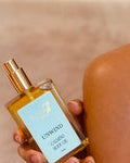 Small bottle of perfume with a blurred background