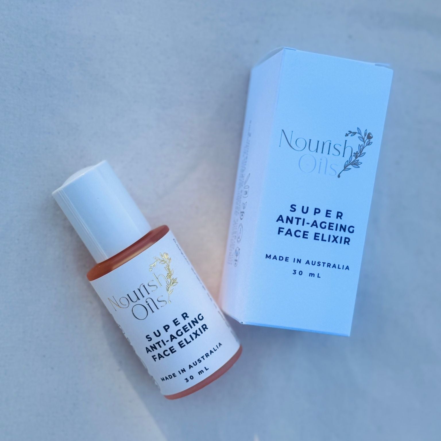 Super Anti-Ageing Face Elixir bottle and box on a light gray background