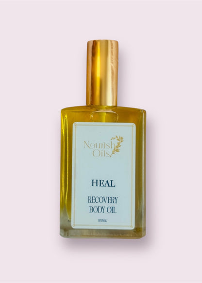 Nourish Oils Heal Massage Oil surrounded by raw turmeric root, arnica flowers, and peppermint leaves, highlighting anti-inflammatory botanicals."
